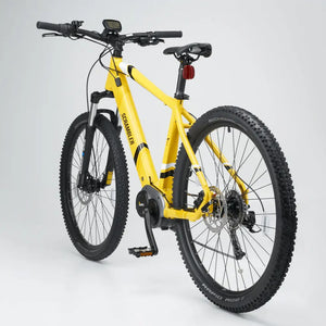 Rear angle of the yellow Mark2 Scrambler C, highlighting the Shimano gears, hydraulic disc brakes, and Schwalbe Rapid Rob tires.