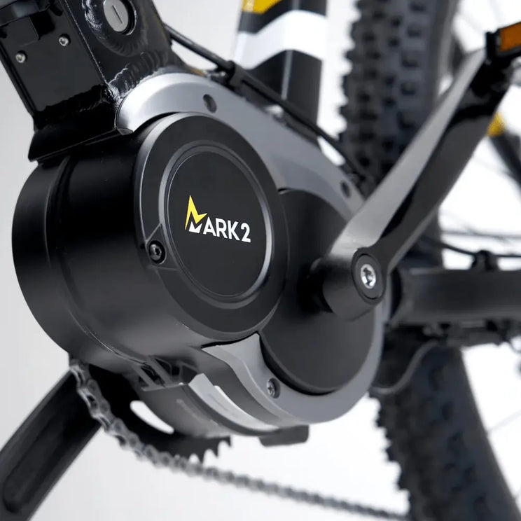 Detailed close-up of the Mark2 Scrambler C electric motor housing on the black frame, showing the Mark2 branding and reinforced mid-drive mount.