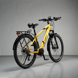 Rear view of the yellow Mark2 Scrambler CX, emphasizing the sturdy luggage rack and rear mudguard perfect for carrying cargo.