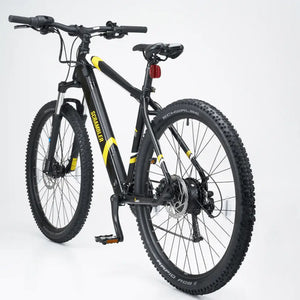 Rear quarter view of the Mark2 Scrambler lightweight electric mountain bike showing the saddle and tires.