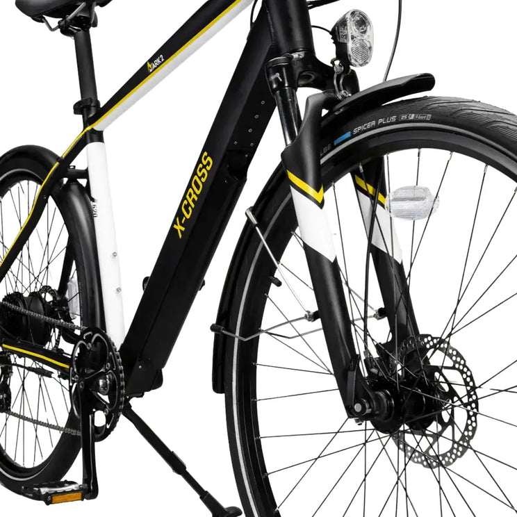 Detail view of the front suspension fork, mudguard mount, and integrated LED headlight.