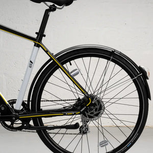 Close-up of the rear wheel, protective mudguard, and sturdy kickstand on the Mark2 X-Cross 520.