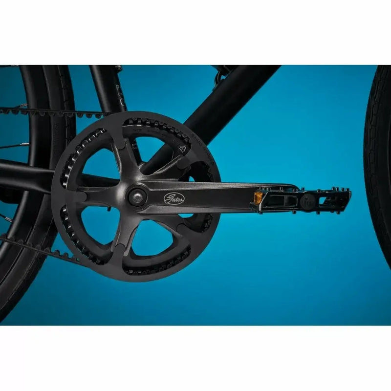 Close-up of the low-maintenance Gates Carbon Drive belt system and crankset on the Pure Flux One e-bike.