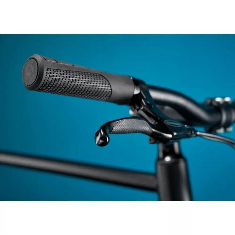 Close-up of the textured ergonomic handlebar grips and brake lever on the Pure Flux One electric bike.