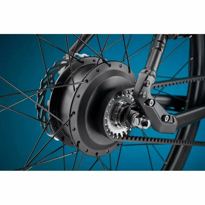 Close-up view of the rear hub motor and single-speed belt drive cog on the Pure Flux One electric hybrid.