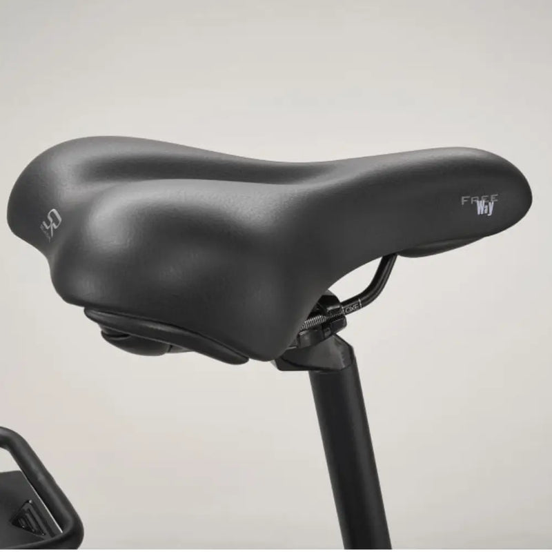 Close-up of the cushioned comfort saddle on the Pure Free City electric hybrid bike.