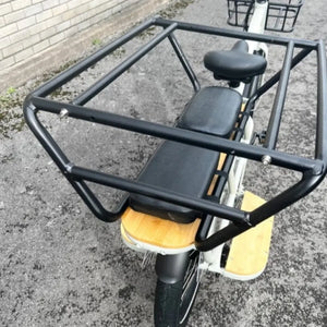 Top-down detail shot showing the spacious rear wooden deck enclosed by a protective metal safety cage.