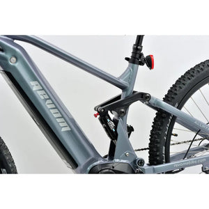Close-up of Revom M1 e-MTB frame highlighting rear shock suspension and battery integration.