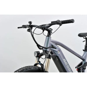 revom m1 full-suspension e-mtb handlebar with front light and controls.