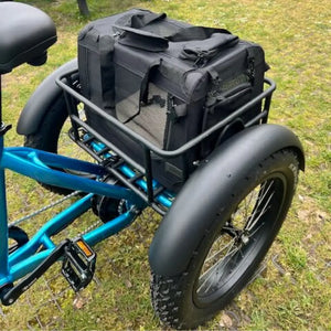 Revom pet transport bag securely mounted on the rear cargo rack of a fat tire electric tricycle.