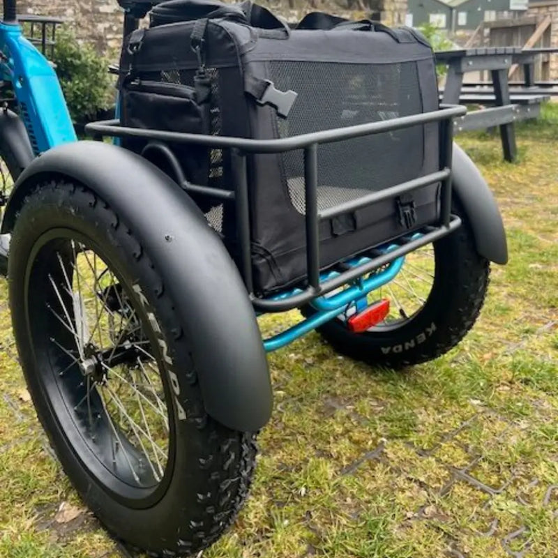 Rear angled view of the Revom pet transport bag on a fat tire electric trike, ideal for dog transport.