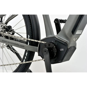 Close-up of the mid-drive electric motor and chain on the Revom S1 ATB bike.