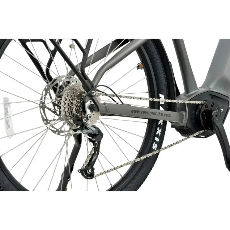 Close-up of the rear wheel, cassette, and derailleur on the Revom S1 electric bike.