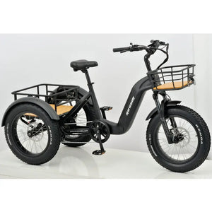 Front angled shot of the Revom T2 electric trike showing the front cargo basket, suspension fork, and LED headlight.