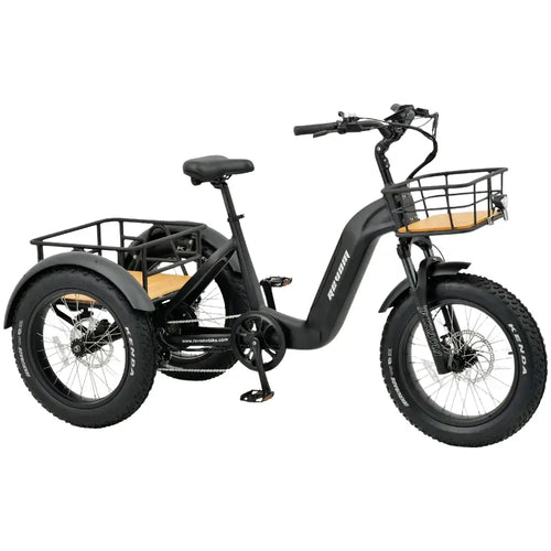 Front angled shot of the Revom T2 electric trike showing the front cargo basket, suspension fork, and LED headlight.