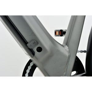 Revom U1 all-terrain e-bike dark grey frame with charging port detail.
