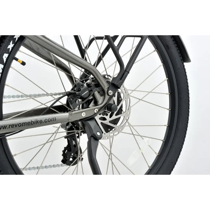 Close-up of the Revom U2 All-Terrain electric bike rear disc brake and gear system.