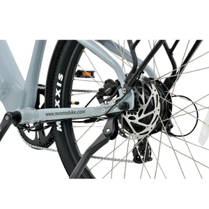 Rear wheel detail of Revom U2 all terrain electric bike showing disc brake, hub motor, and drivetrain components.