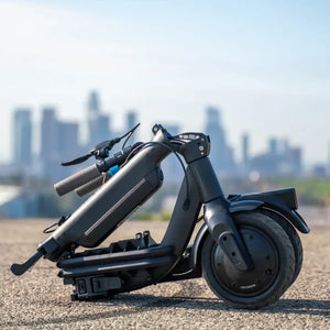 The Riley RS3 electric scooter folded compactly on the ground with a city skyline in the background.