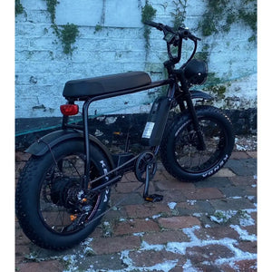 Rear side angle of the Rocket 88X Fat Boy e-bike showing padded seat, rear light, and fat tyres for off-road use.