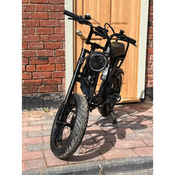 Rocket ST fat tyre electric bike front view with round headlight and thick tyres