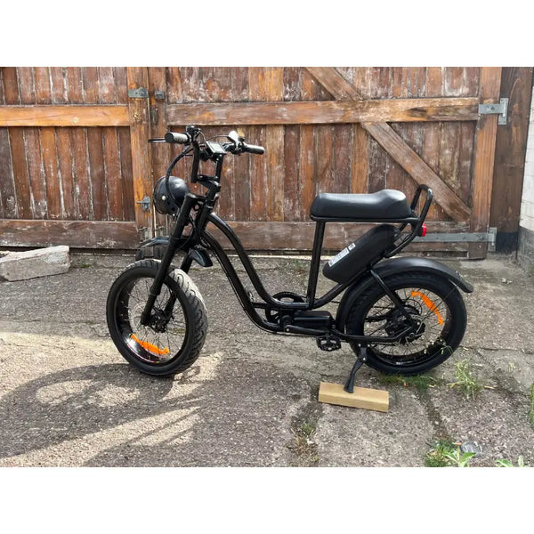 Rocket ST step-through electric bike with fat tyres and rear hub motor parked outdoors