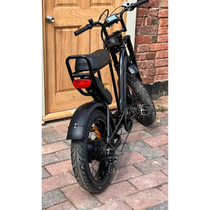 Rocket ST electric step-through fat tyre bike rear view parked on concrete