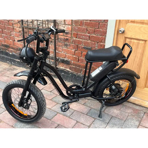 Rocket ST step-through electric fat tyre bike left side view on driveway