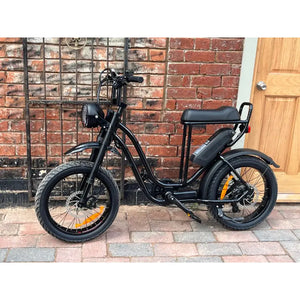 Rocket ST electric step-through fat tyre bike side view parked on concrete