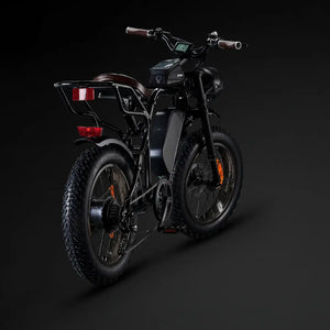 Rear view of the black Rocket SX e-bike highlighting the rear hub motor, cassette, and sturdy cargo rack.