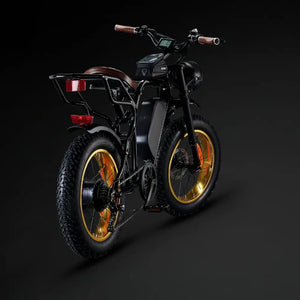 Rear view of the black Rocket SX e-bike highlighting the rear hub motor, cassette, and sturdy cargo rack.