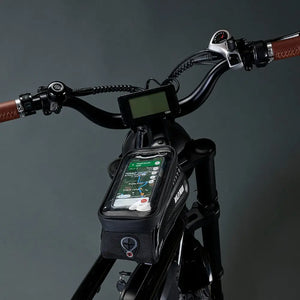 Close-up of the waterproof "Wild Man" storage bag mounted on the top tube of the blue Rocket SX frame.