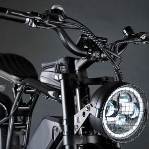 Close-up of the Rocket X high-output LED headlight featuring a black metal protective grill guard.