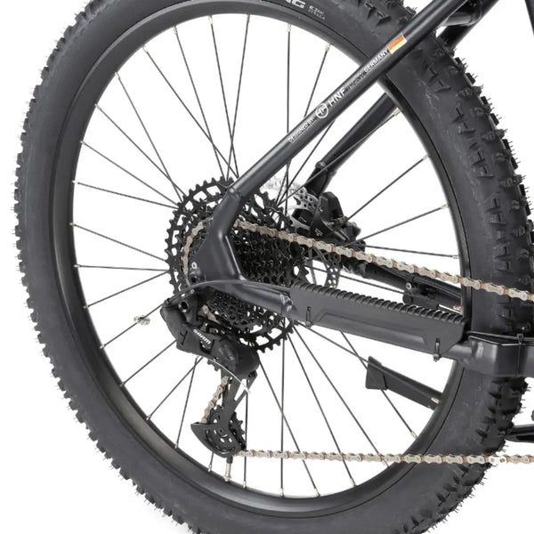 Close-up of the Viking Pro Electric Mountain Bike rear derailleur and cassette, designed for smooth off-road gear shifting.