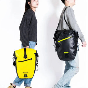Models carrying Rhinowalk waterproof rear rack panniers in yellow and black.