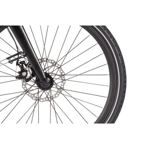 Close-up of the front disc brake system on the Wisper 905 Crossbar Touring Hybrid Electric Bike 250W, highlighting the spokes, brake rotor, and tyre detail.