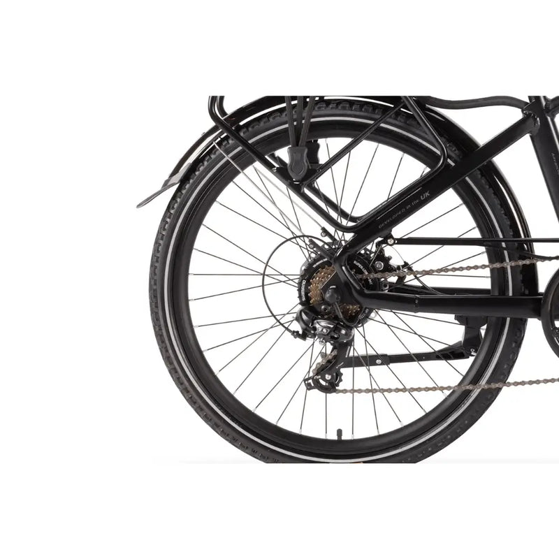 Detailed view of the Wisper 905 Crossbar Touring Hybrid Electric Bike's rear wheel with Shimano derailleur and hybrid touring frame, showcasing the drivetrain and tyre tread.