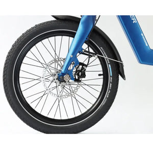 Detailed view of the 20-inch front wheel on the Wisper Tailwind e-bike, featuring a hydraulic disc brake and Schwalbe Big Ben Plus tire.