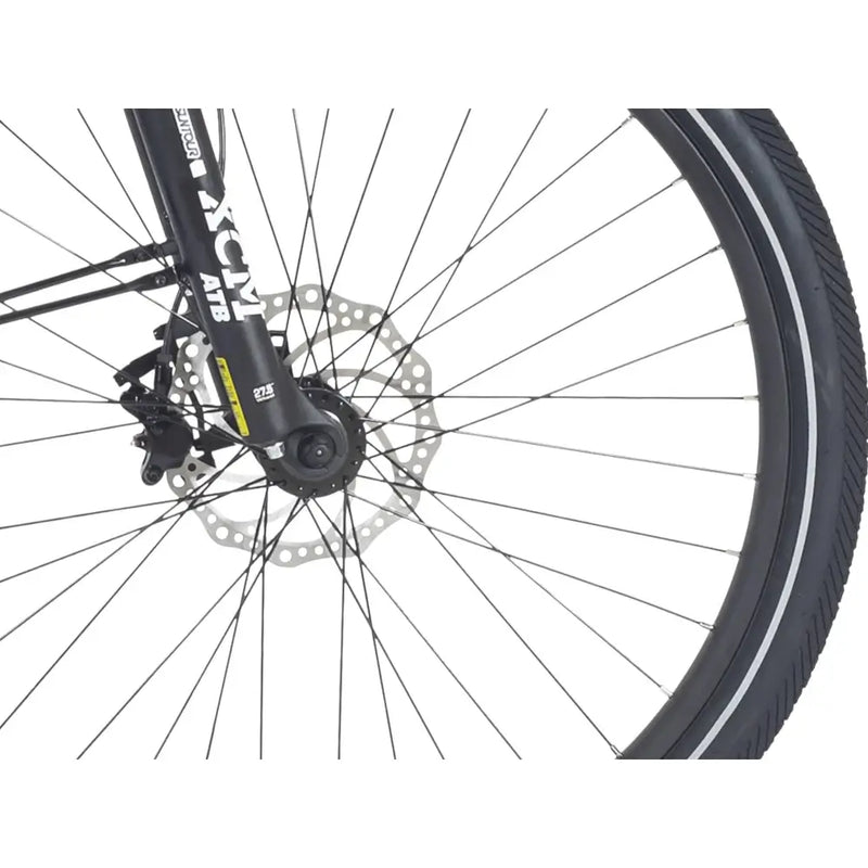 Detail of the front Kenda tyre and disc brake on the Wisper Wayfarer H9 electric mountain bike, featuring Suntour XCM forks.